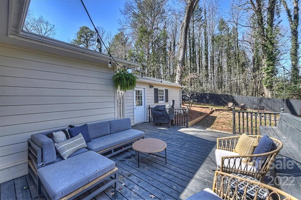 5638 Londonderry Road Charlotte, NC 28210 - Photo 33 of 44 a view of a deck with couches table and chairs with wooden floor
