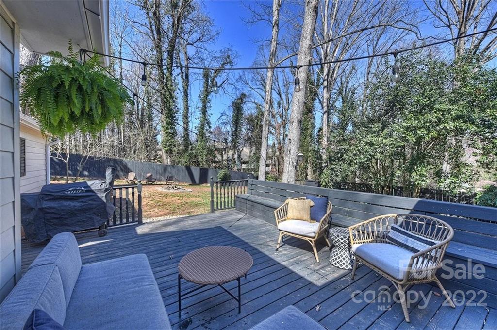 5638 Londonderry Road Charlotte, NC 28210 - Photo 34 of 44 a patio with wooden floor and outdoor seating