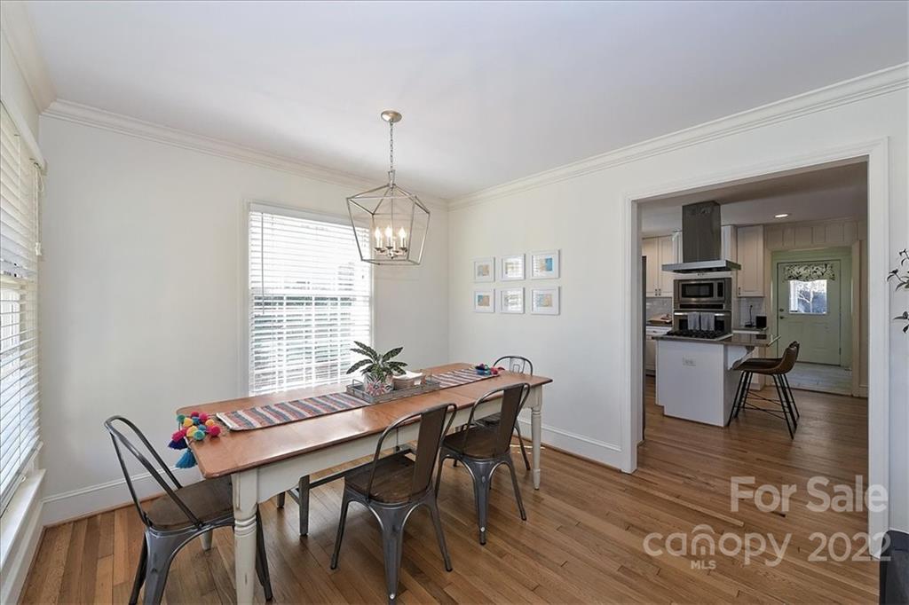 5638 Londonderry Road Charlotte, NC 28210 - Photo 10 of 44 a view of a dining room with furniture window and wooden floor