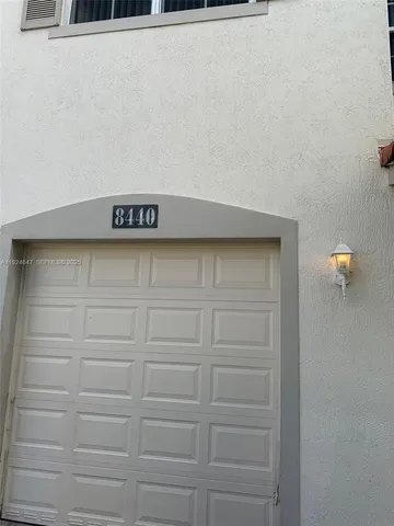 a kitchen with a refrigerator sink and stove
