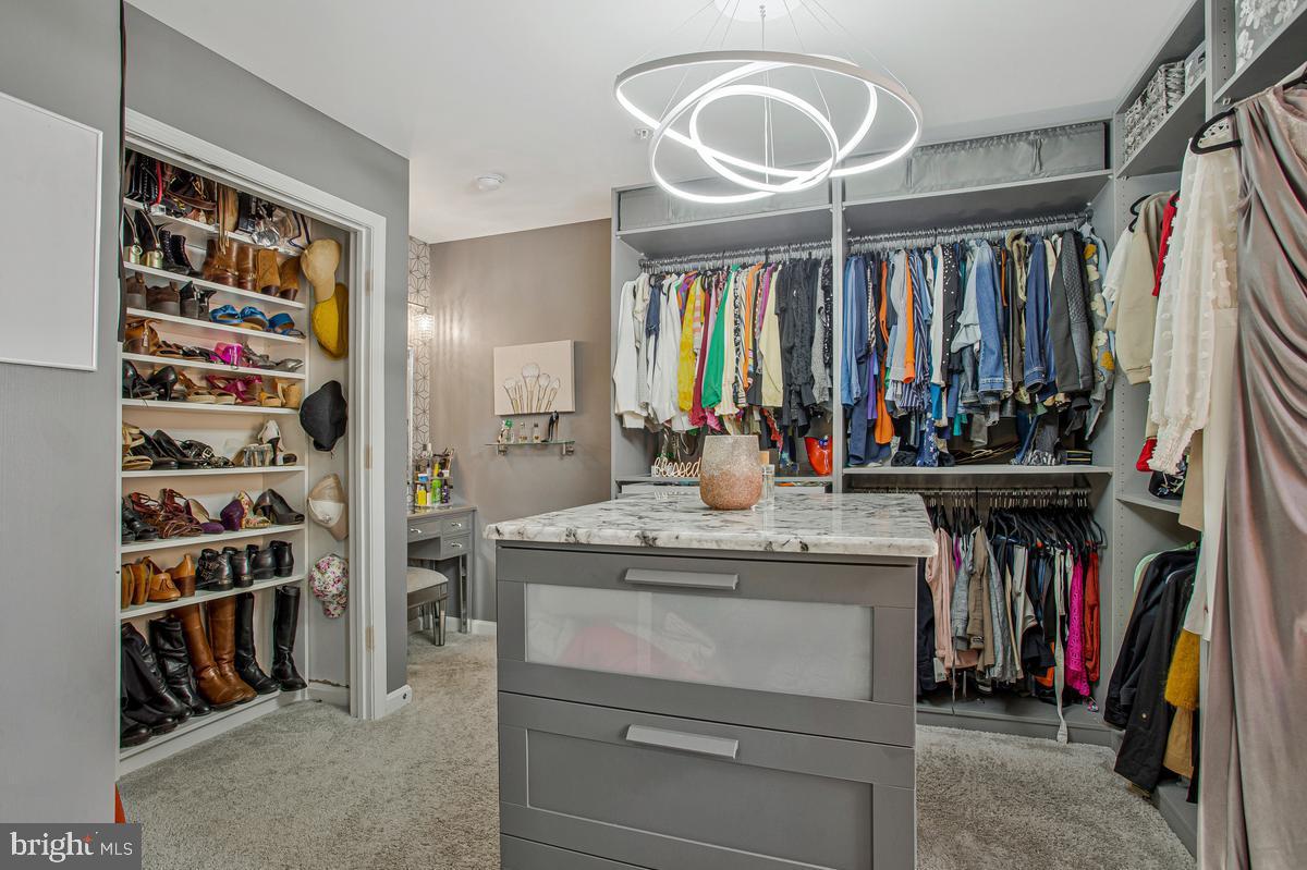 8704 Alexa Road Clinton, MD 20735 - Photo 28 of 42 Custom walk-in closet with organized storage