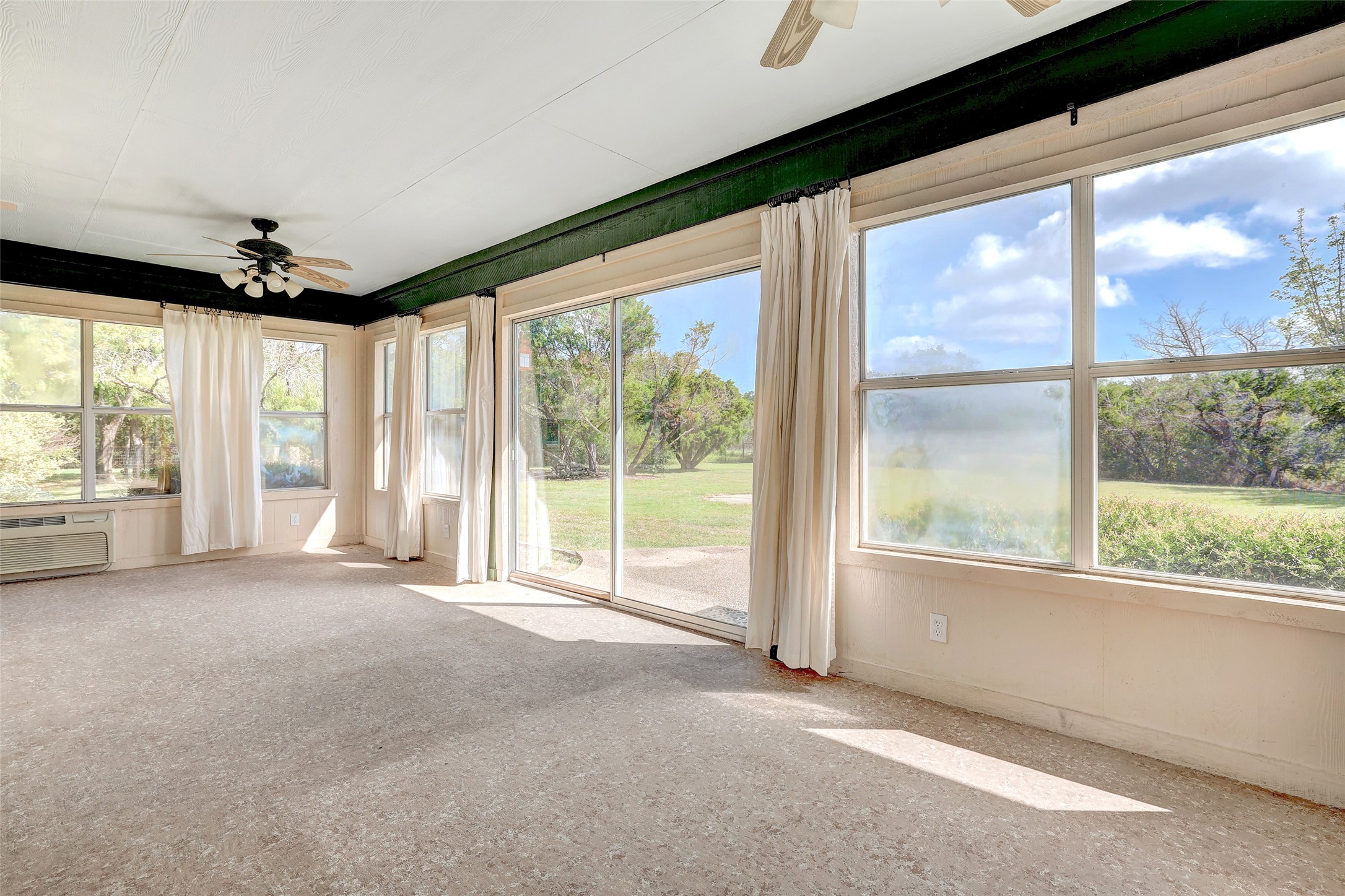 125 Kyle Lane Georgetown, TX 78633 - Photo 27 of 34 Unfurnished sunroom with baseboards and carpet floors