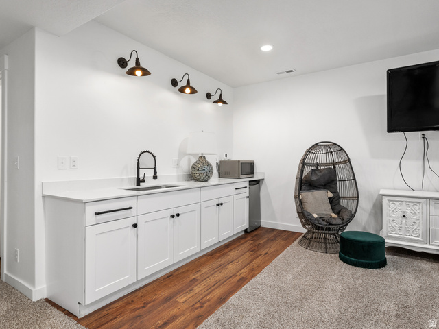 627 South Meade Street Mapleton, UT 84664 - Photo 21 of 48 Wet bar featuring crisp white cabinetry, light-toned countertop, and a matte black gooseneck faucet