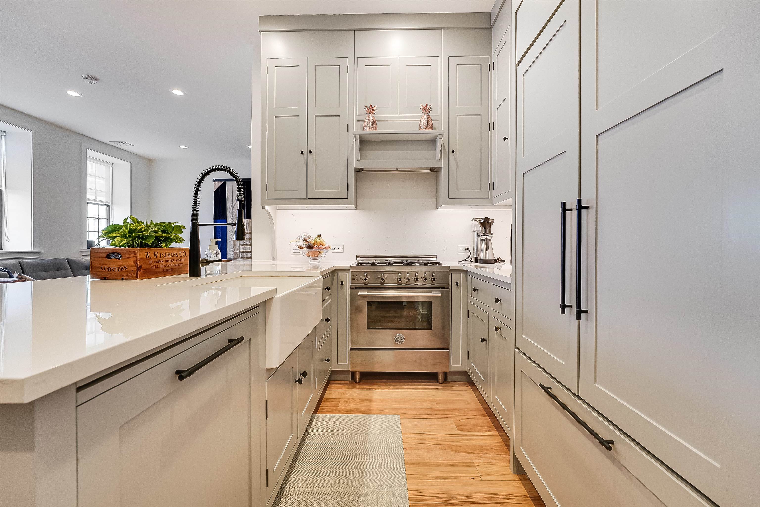 222 Clinton Street, Unit 19 Hoboken, NJ 07030 - Photo 13 of 31 a kitchen with stainless steel appliances a refrigerator sink and white cabinets