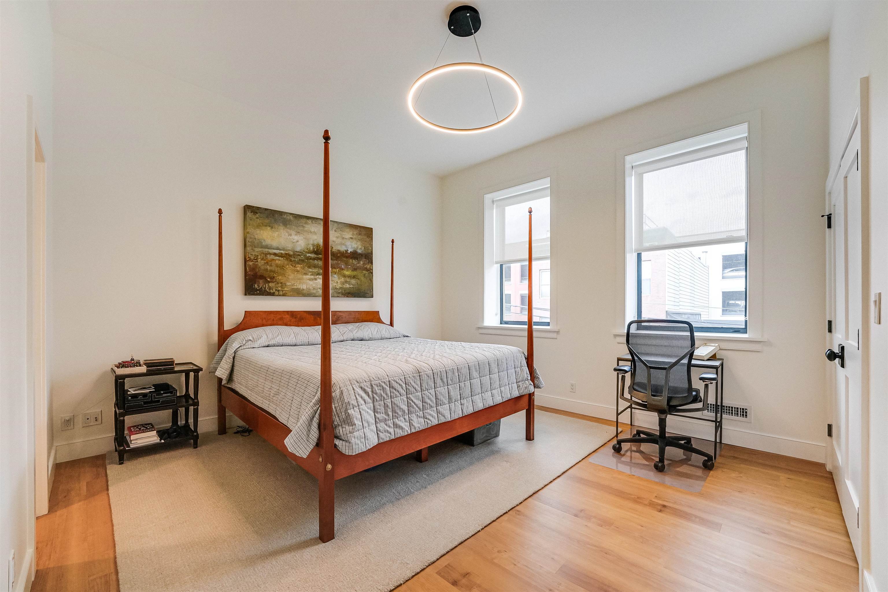 222 Clinton Street, Unit 19 Hoboken, NJ 07030 - Photo 16 of 31 a bedroom with a bed and a window