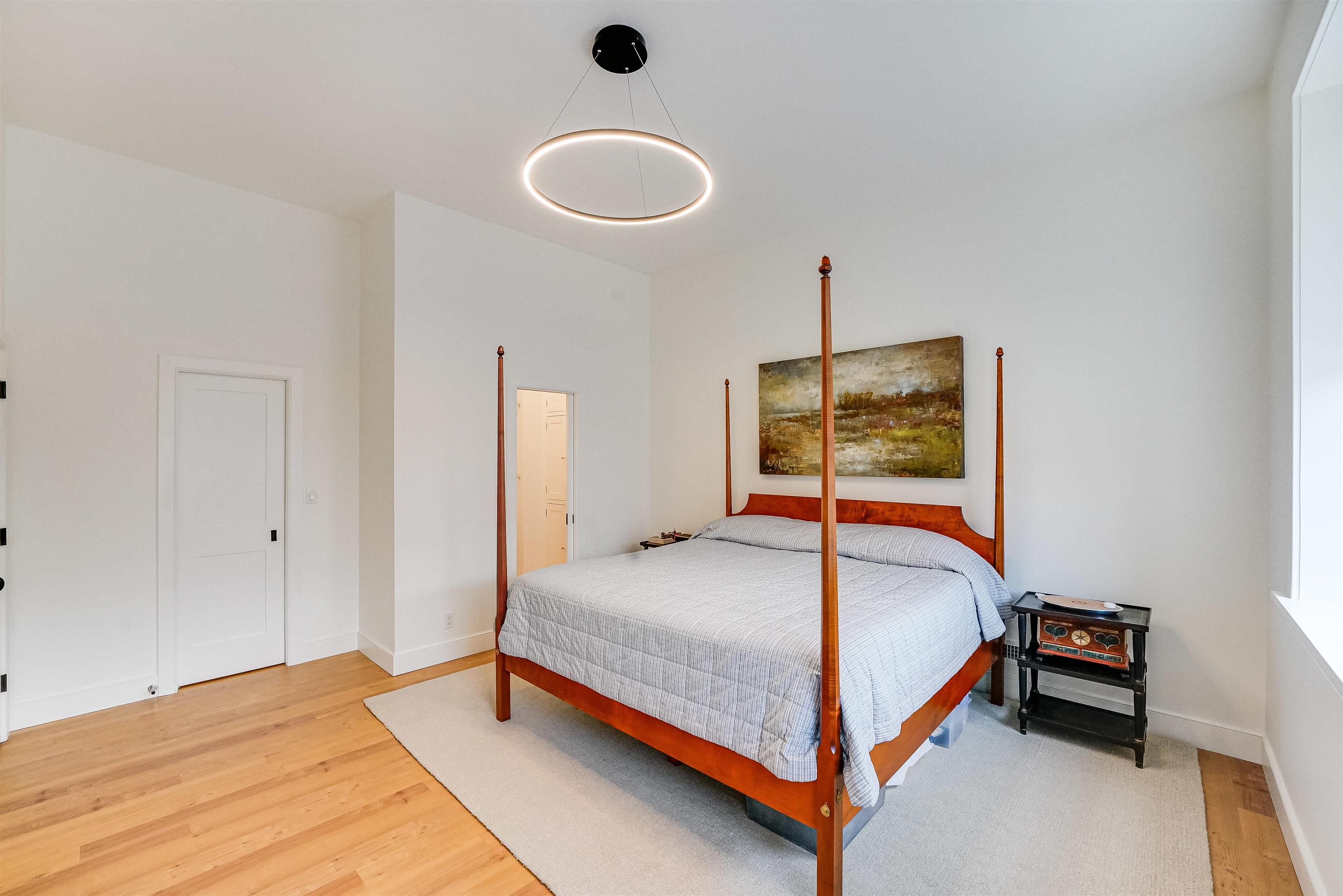 222 Clinton Street, Unit 19 Hoboken, NJ 07030 - Photo 17 of 31 a bedroom with a bed and a table