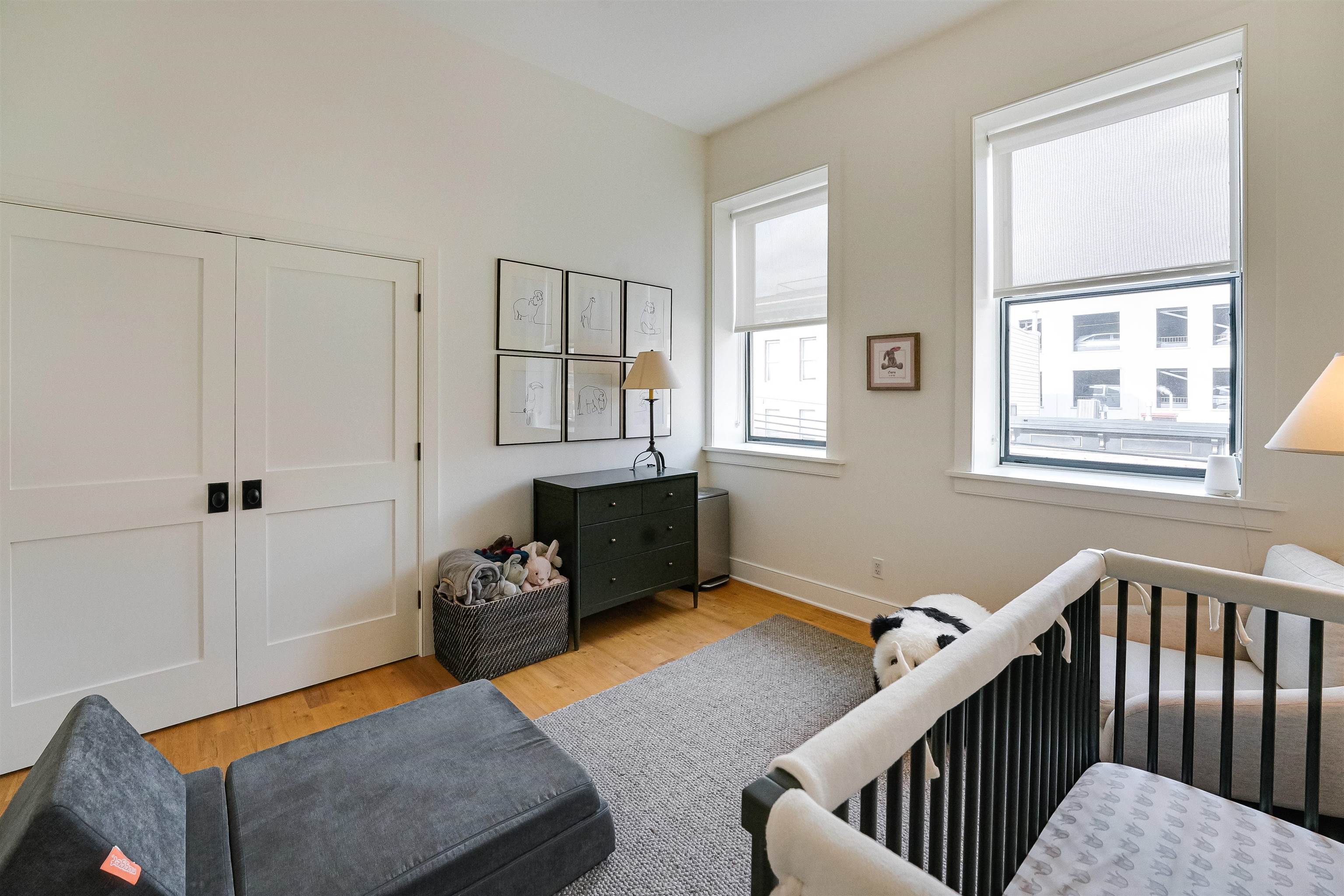 222 Clinton Street, Unit 19 Hoboken, NJ 07030 - Photo 19 of 31 a bedroom with furniture and wooden floor
