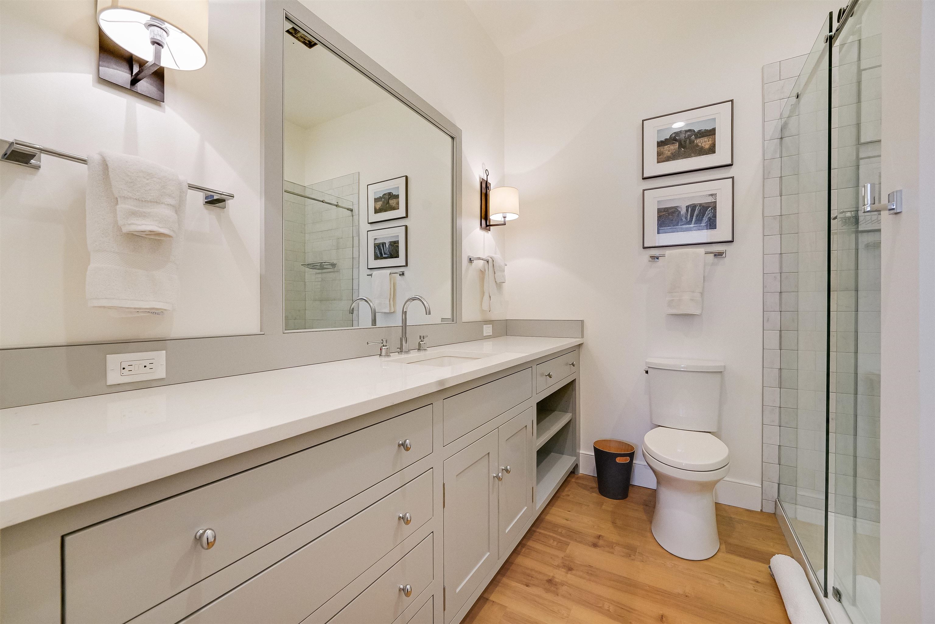 222 Clinton Street, Unit 19 Hoboken, NJ 07030 - Photo 21 of 31 a bathroom with a sink a toilet a shower and a mirror