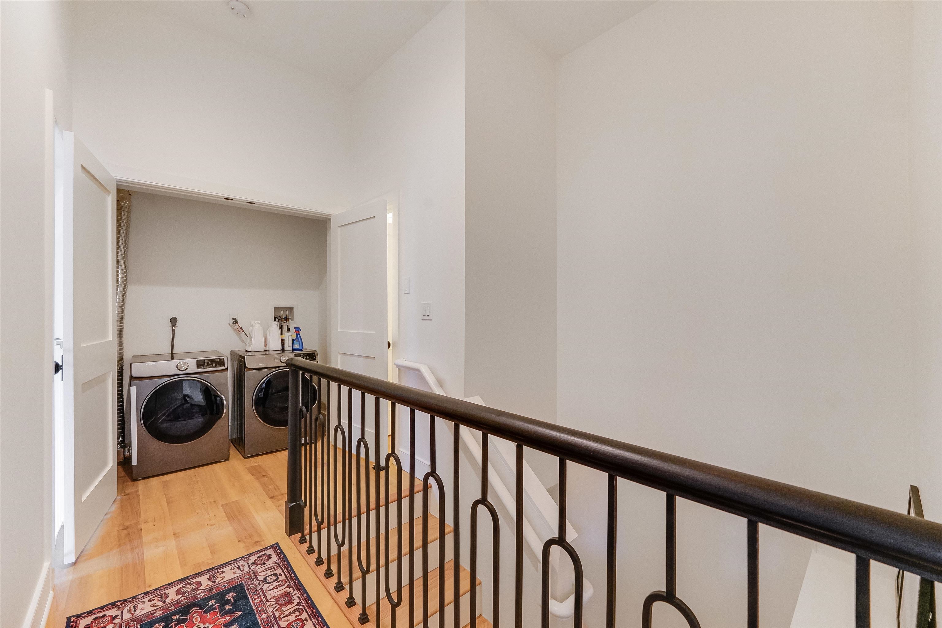 222 Clinton Street, Unit 19 Hoboken, NJ 07030 - Photo 25 of 31 a view of a hallway to a dining room with wooden floor and a sink