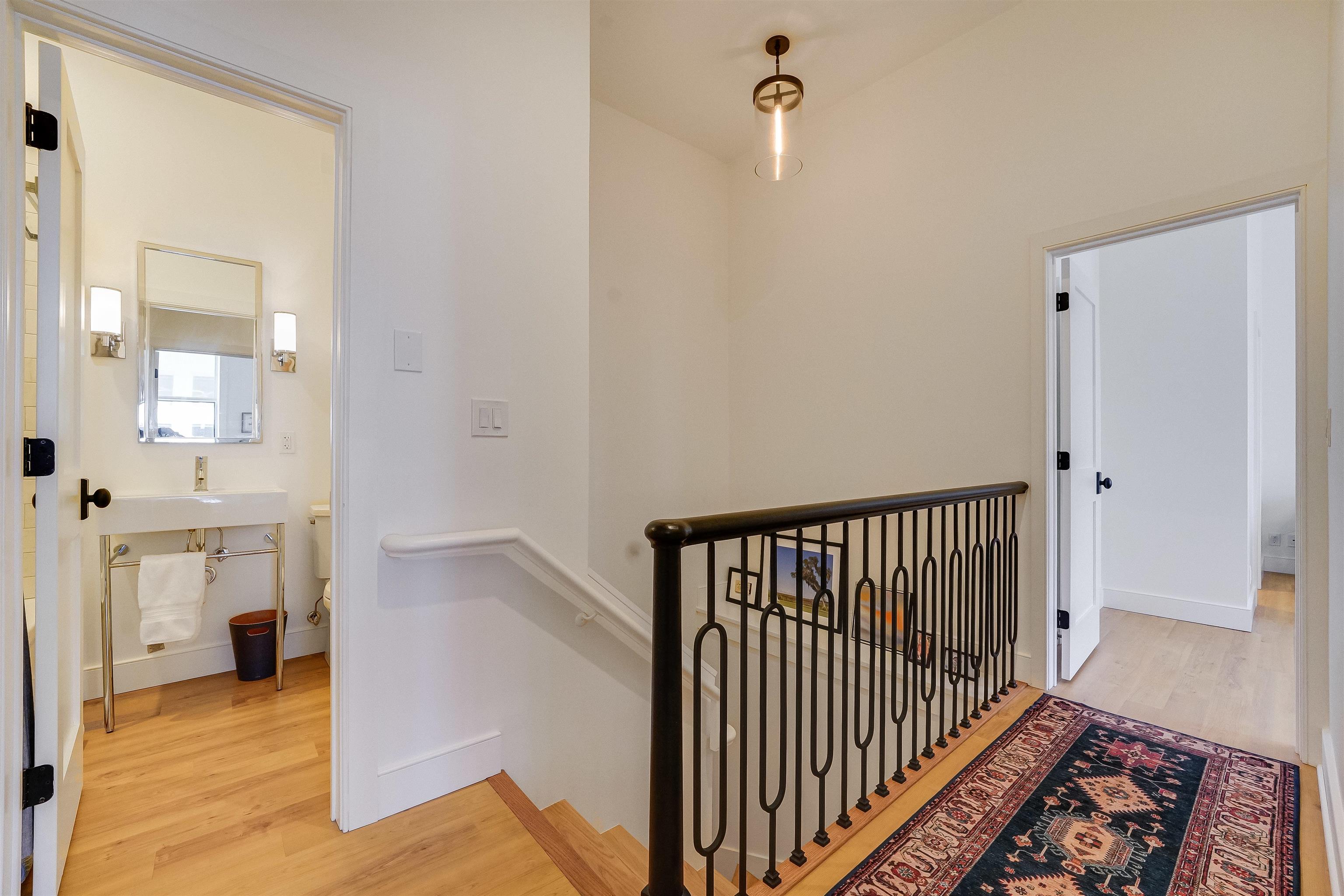 222 Clinton Street, Unit 19 Hoboken, NJ 07030 - Photo 26 of 31 a view of a hallway with a dining room and wooden floor
