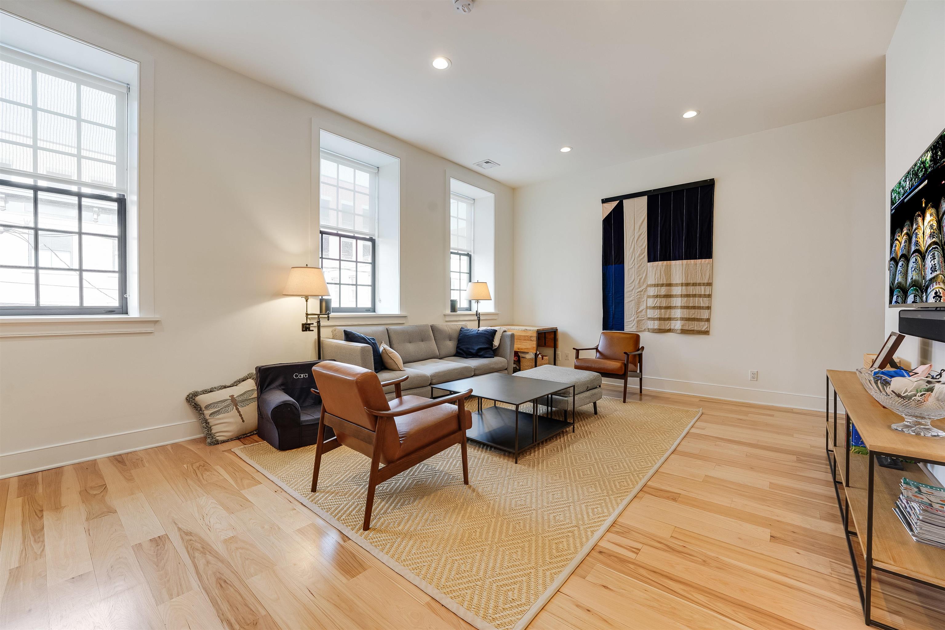 222 Clinton Street, Unit 19 Hoboken, NJ 07030 - Photo 3 of 31 a living room with furniture and a window