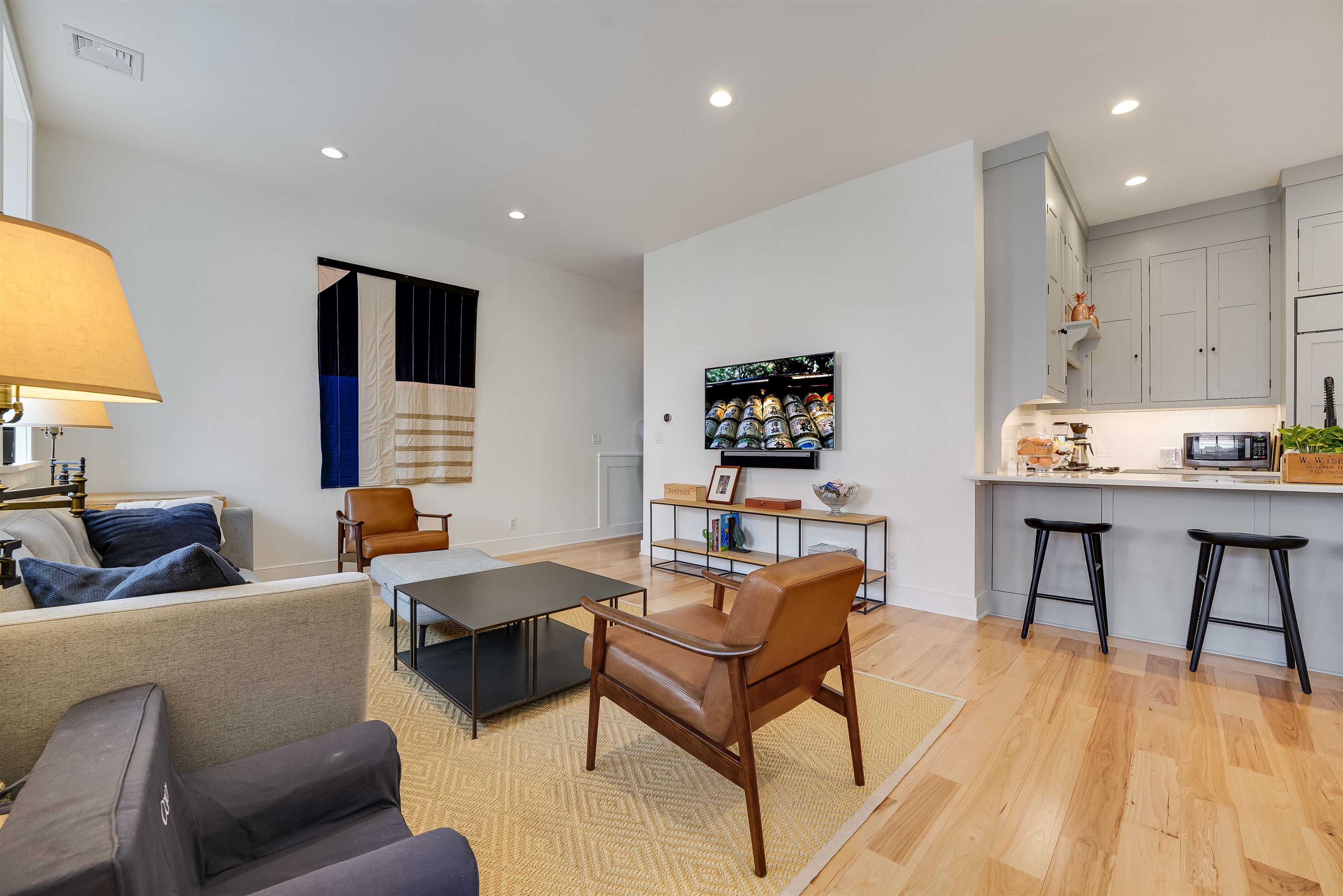 222 Clinton Street, Unit 19 Hoboken, NJ 07030 - Photo 4 of 31 a living room with furniture and a wooden floor