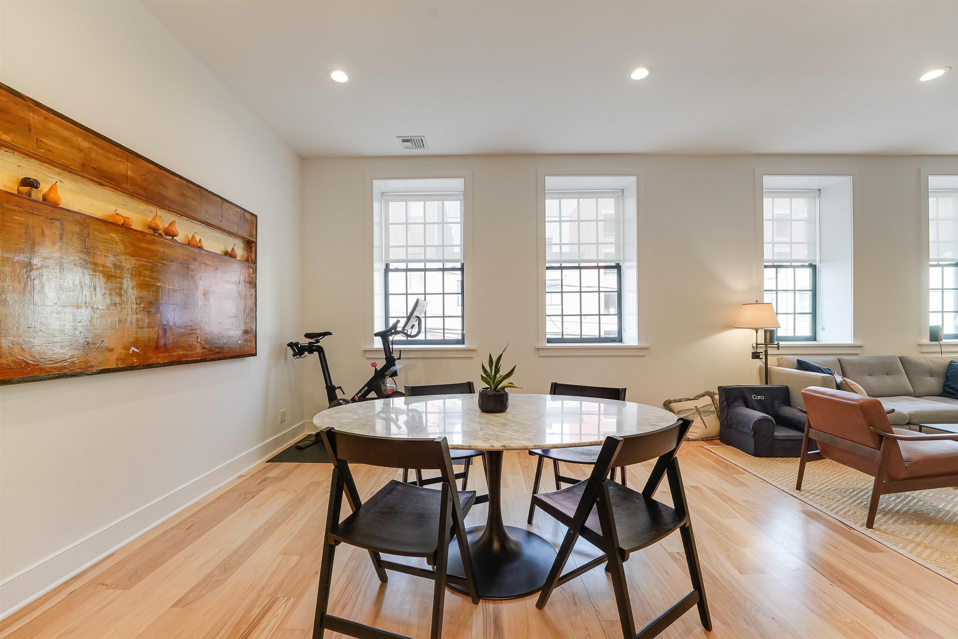 222 Clinton Street, Unit 19 Hoboken, NJ 07030 - Photo 8 of 31 a dining room with furniture and wooden floor
