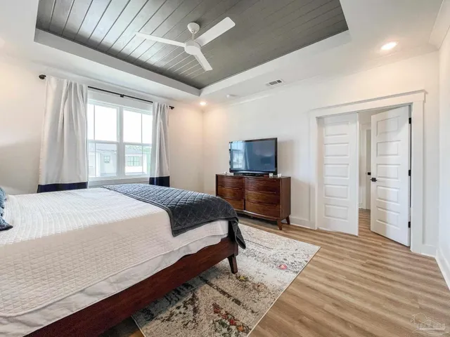 a bedroom with a bed and a dresser