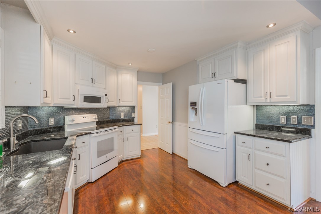 3103 E Stony Point Road, Unit END Richmond, VA 23235 - Photo 16 of 50 a kitchen with granite countertop white cabinets and white appliances