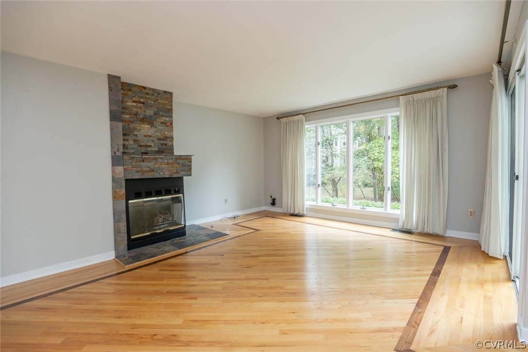 3103 E Stony Point Road, Unit END Richmond, VA 23235 - Photo 23 of 50 a view of empty room with wooden floor and fireplace