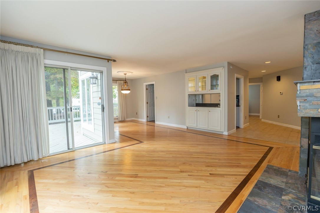 3103 E Stony Point Road, Unit END Richmond, VA 23235 - Photo 25 of 50 a view of empty room with wooden floor and a large window