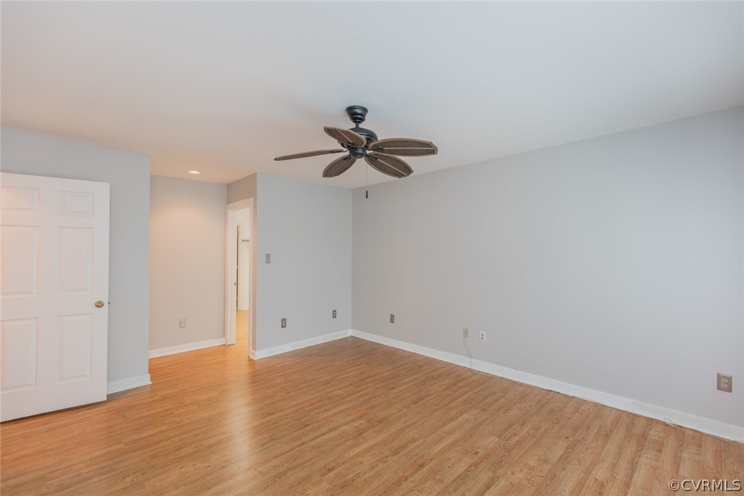 3103 E Stony Point Road, Unit END Richmond, VA 23235 - Photo 31 of 50 a view of a room with wooden floor and a ceiling fan