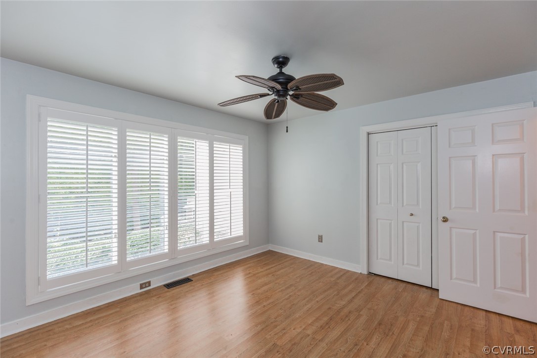 3103 E Stony Point Road, Unit END Richmond, VA 23235 - Photo 38 of 50 a view of an empty room with a window and wooden floor