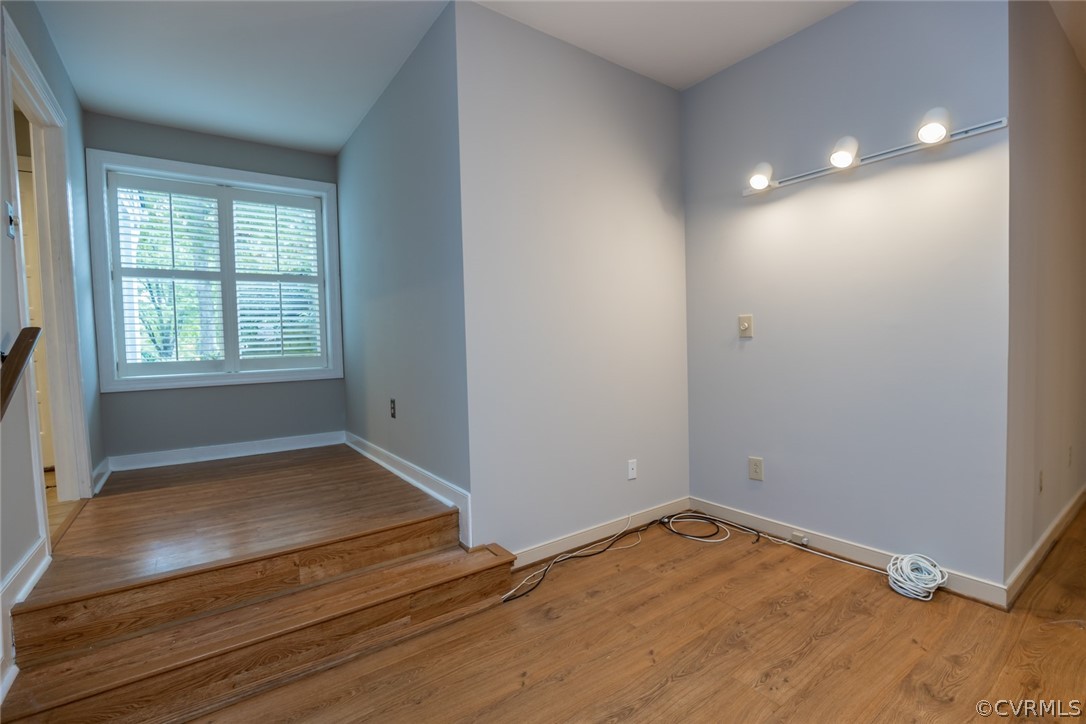 3103 E Stony Point Road, Unit END Richmond, VA 23235 - Photo 41 of 50 an empty room with wooden floor and windows