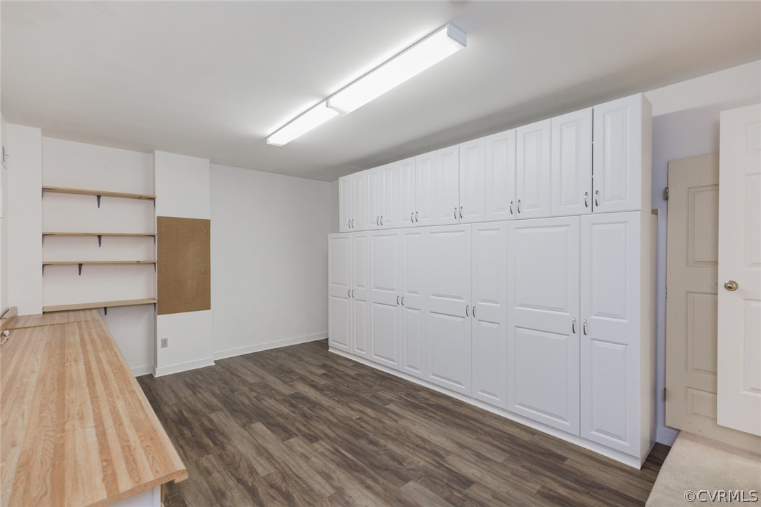 3103 E Stony Point Road, Unit END Richmond, VA 23235 - Photo 49 of 50 a view of a room with wooden floor and cabinets