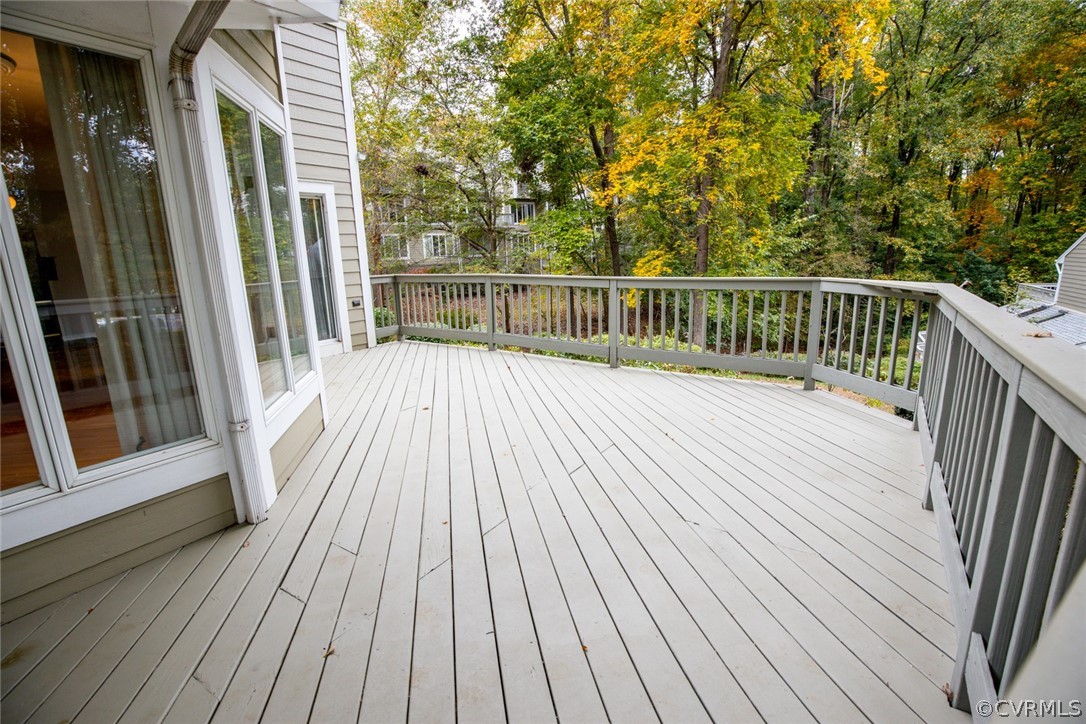 3103 E Stony Point Road, Unit END Richmond, VA 23235 - Photo 6 of 50 a balcony with wooden floor and fence