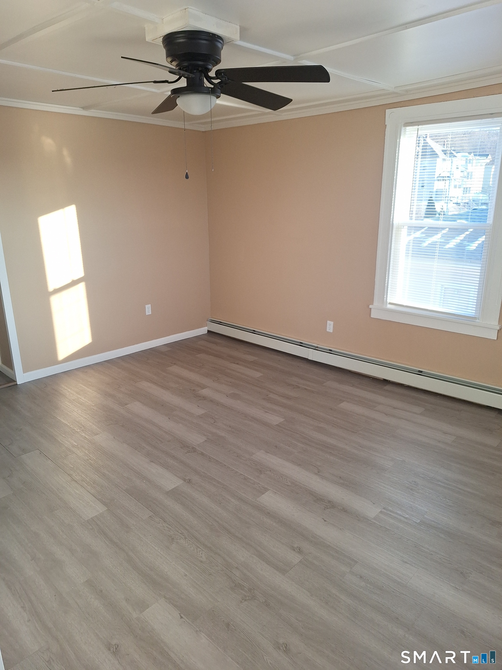 23 1/2 North Spring Street, Unit 3 Ansonia, CT 06401 - Photo 2 of 12 wooden floor in an empty room with a window