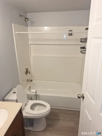 a bathroom with a sink a toilet and bathtub