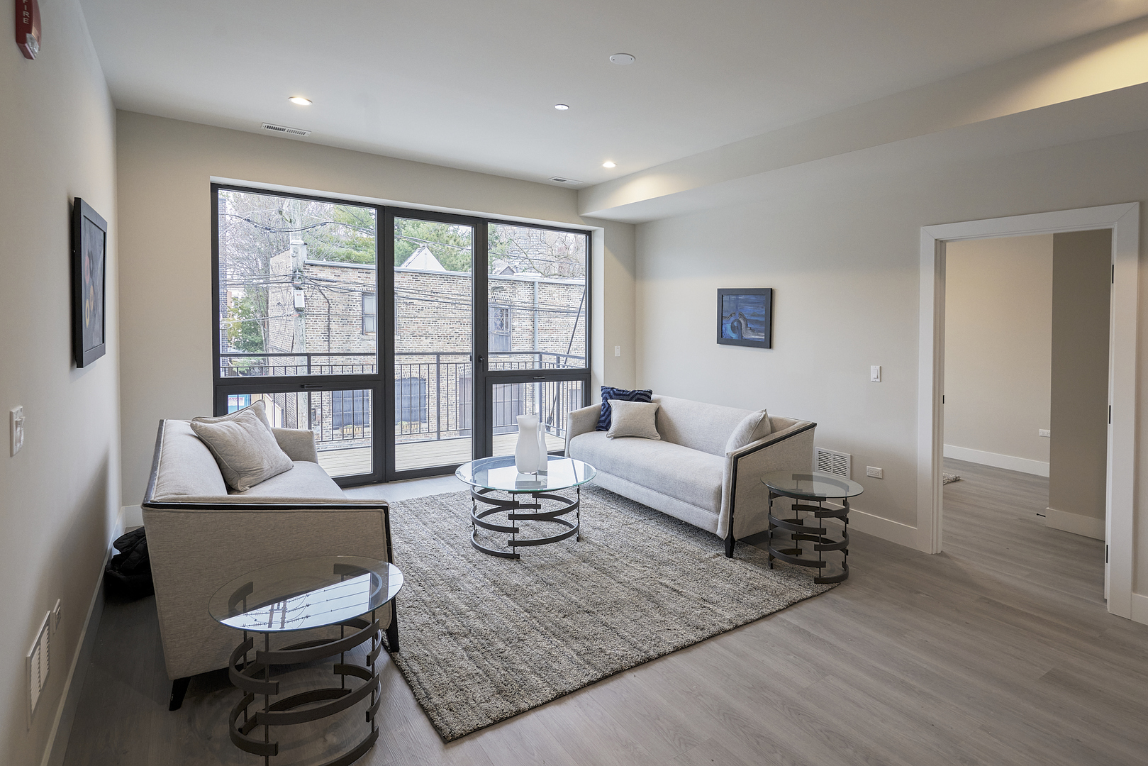 451 East Pershing Road, Unit 503 Chicago, IL 60653 - Photo 7 of 30 a living room with furniture and a large window