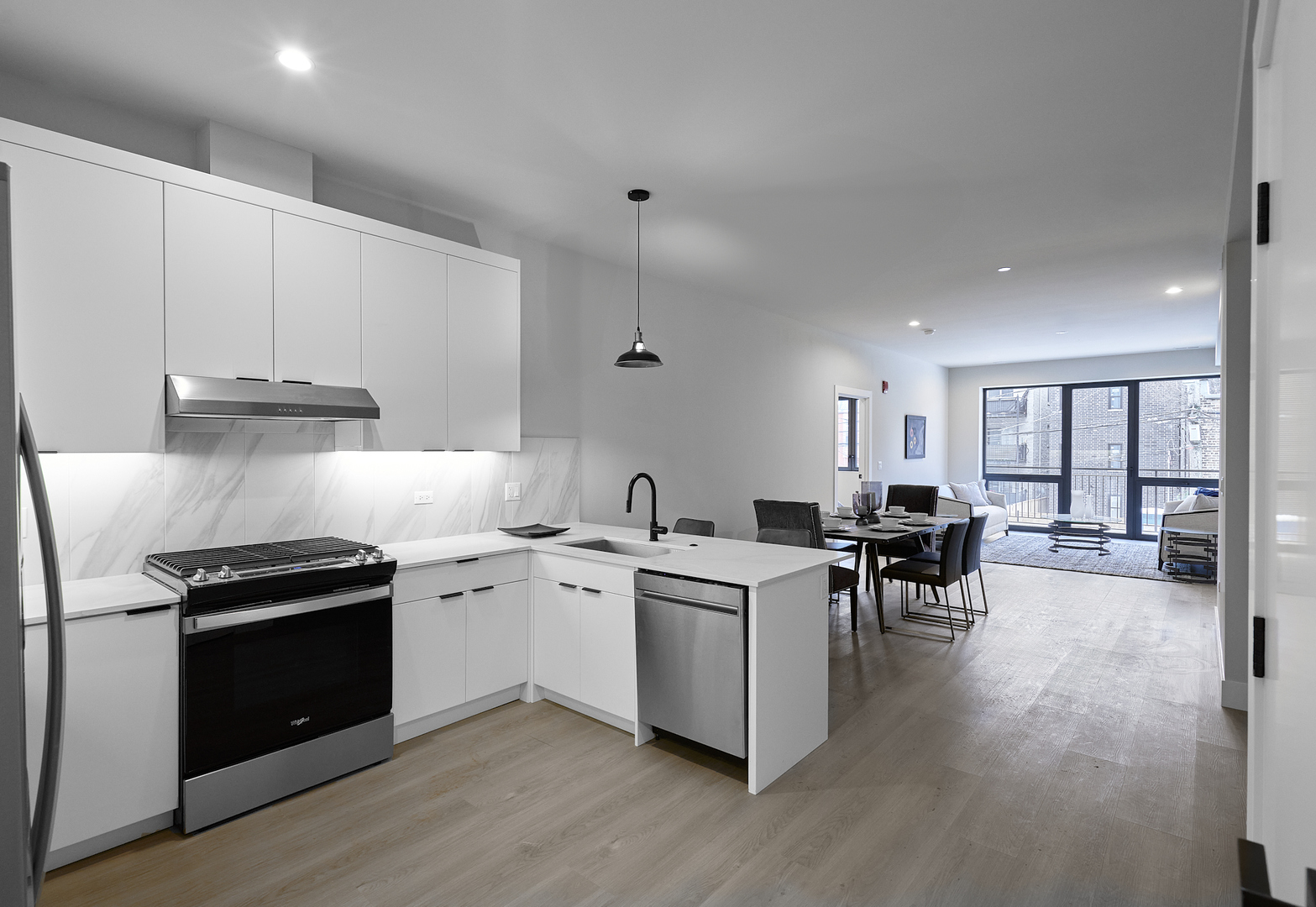 451 East Pershing Road, Unit 503 Chicago, IL 60653 - Photo 9 of 30 a kitchen with a stove and white cabinets