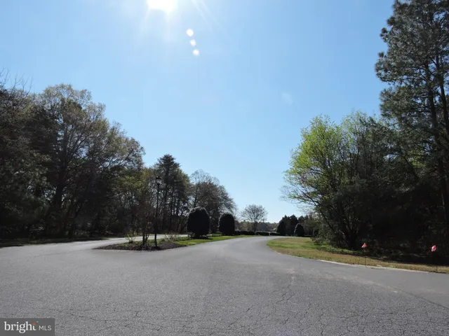 a view of a road with a building in the background