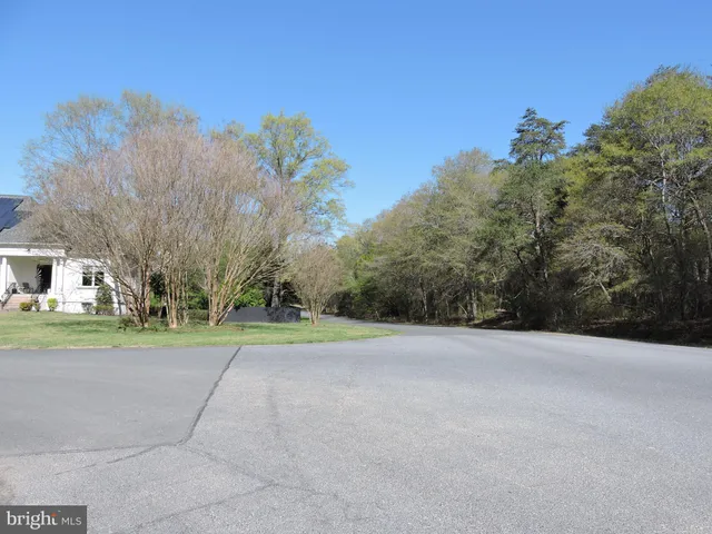 a view of a road with a building in the background
