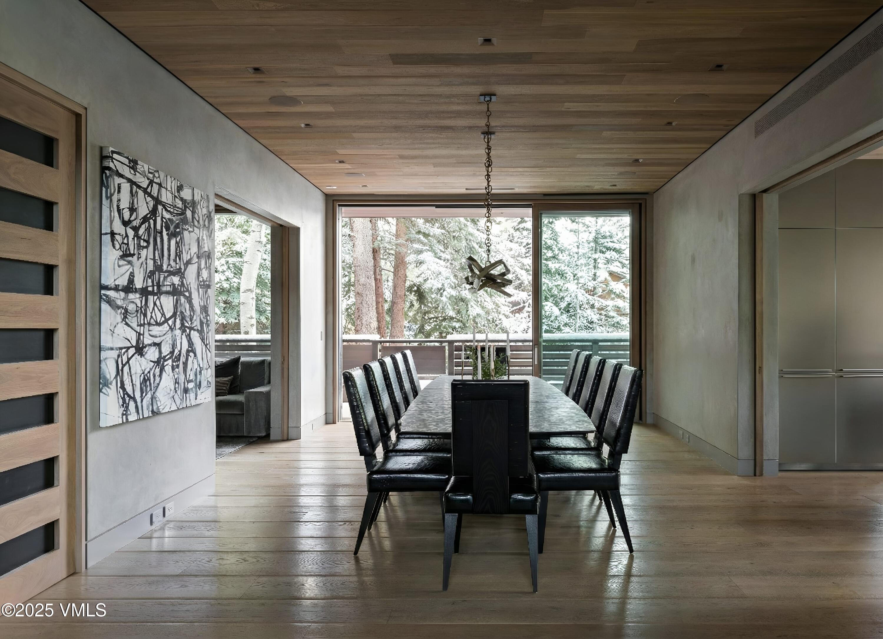 100 Vail Road Vail, CO 81657 - Photo 3 of 25 a view of a dining room with furniture window and wooden floor