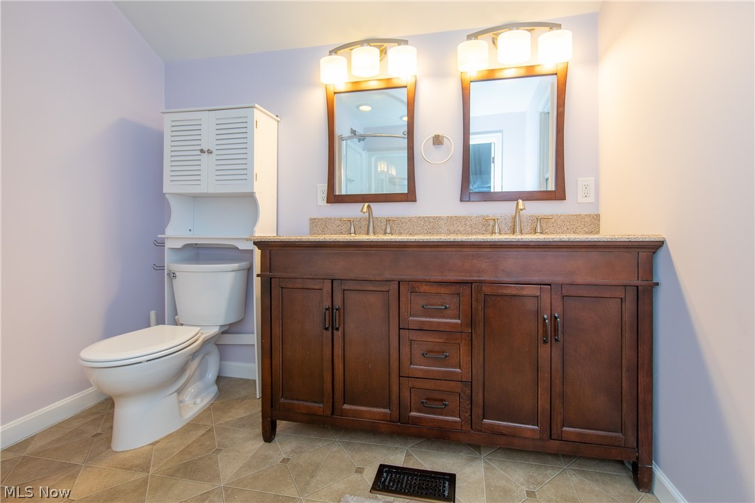 2046 Temblethurst Road South Euclid, OH 44121 - Photo 17 of 35 The remodeled Master Bathroom with twin sink, granite vanity