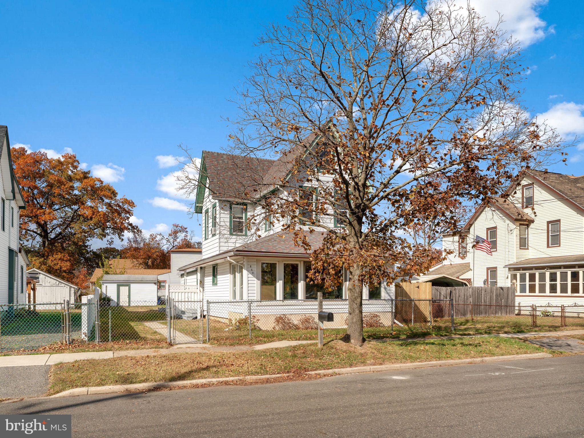 860 Pennsylvania Avenue Delanco, NJ 08075 - Photo 1 of 28 a front view of residential houses with yard and trees
