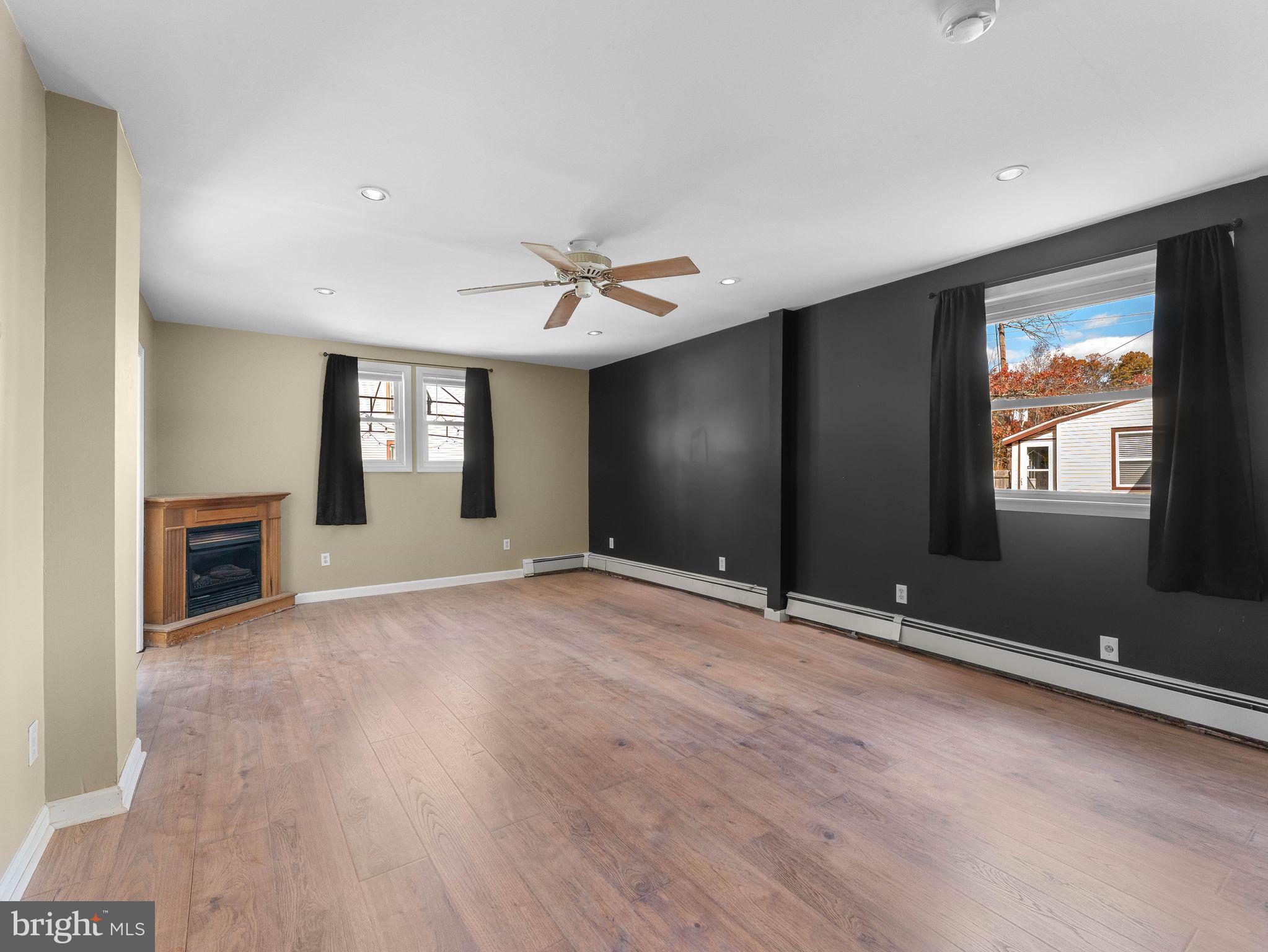 860 Pennsylvania Avenue Delanco, NJ 08075 - Photo 11 of 28 a view of an empty room with window and wooden floor
