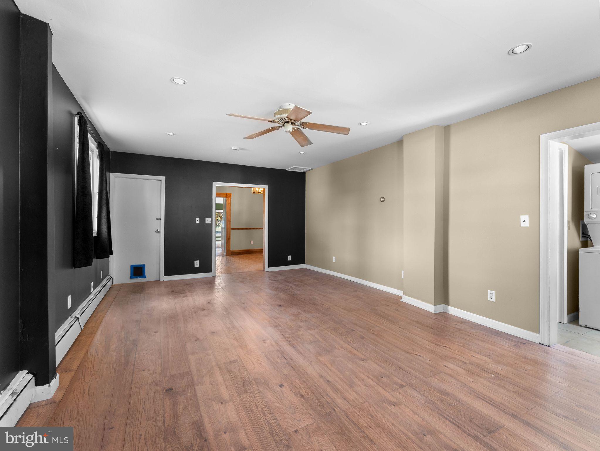 860 Pennsylvania Avenue Delanco, NJ 08075 - Photo 12 of 28 a view of an empty room with wooden floor and a ceiling fan