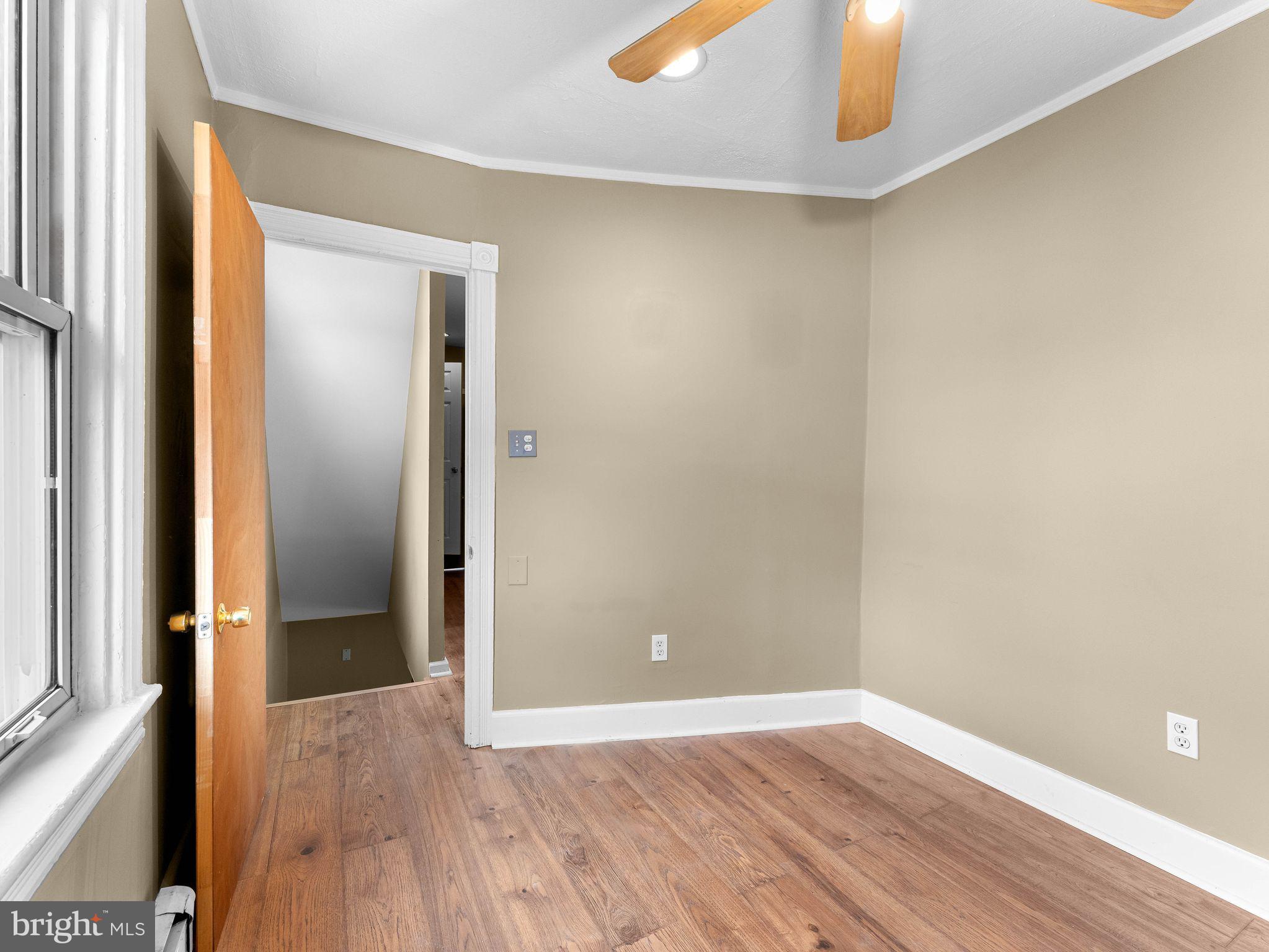 860 Pennsylvania Avenue Delanco, NJ 08075 - Photo 17 of 28 an empty room with wooden floor and entrance