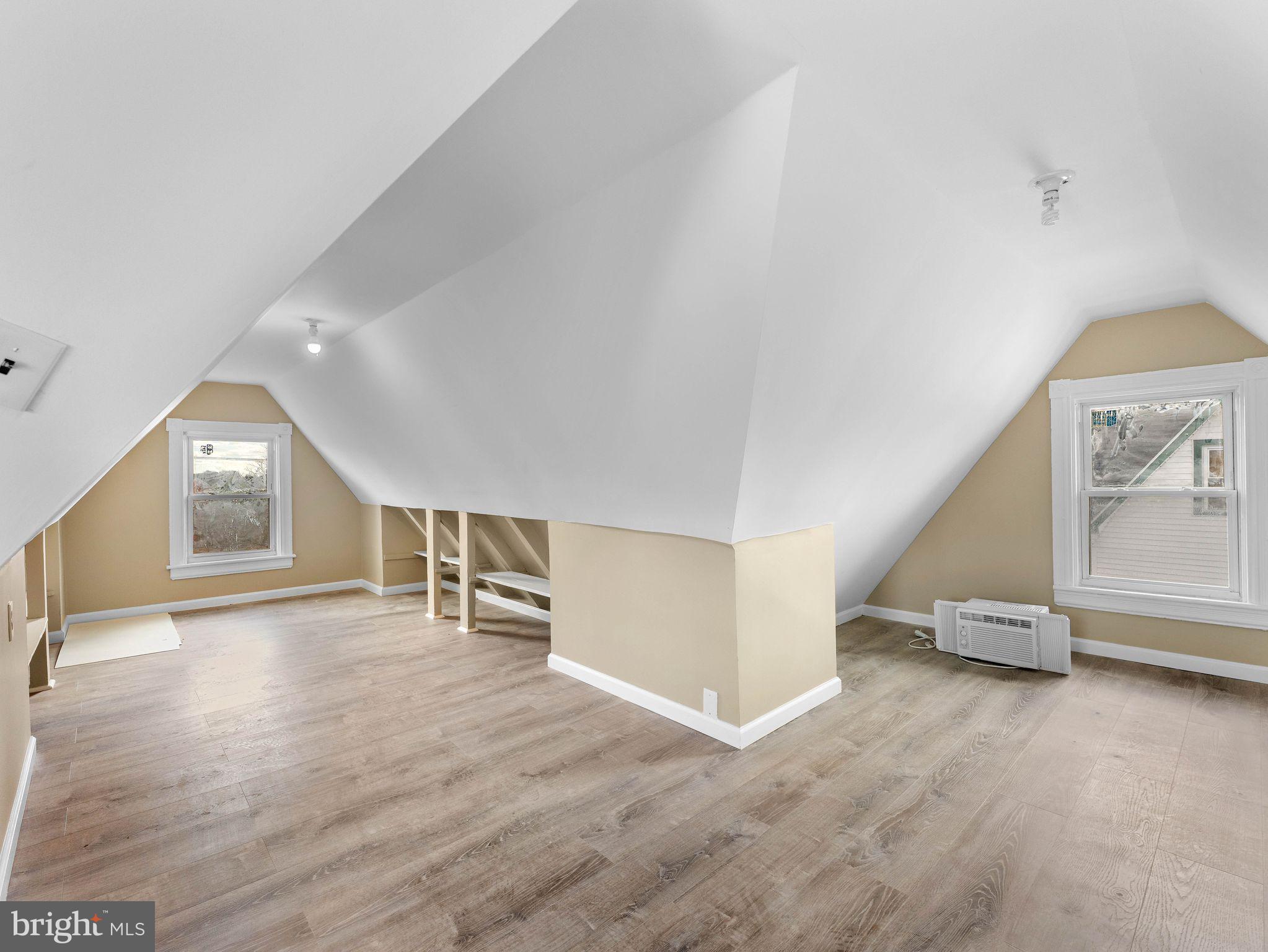 860 Pennsylvania Avenue Delanco, NJ 08075 - Photo 24 of 28 an empty room with wooden floor and windows