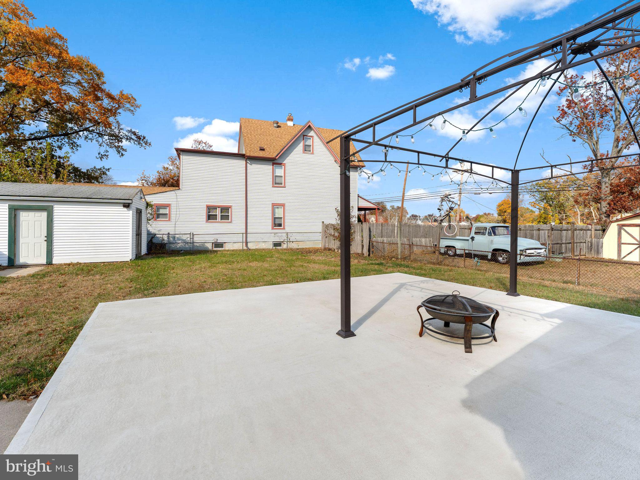 860 Pennsylvania Avenue Delanco, NJ 08075 - Photo 27 of 28 a view of a patio with a table and chairs under an umbrella