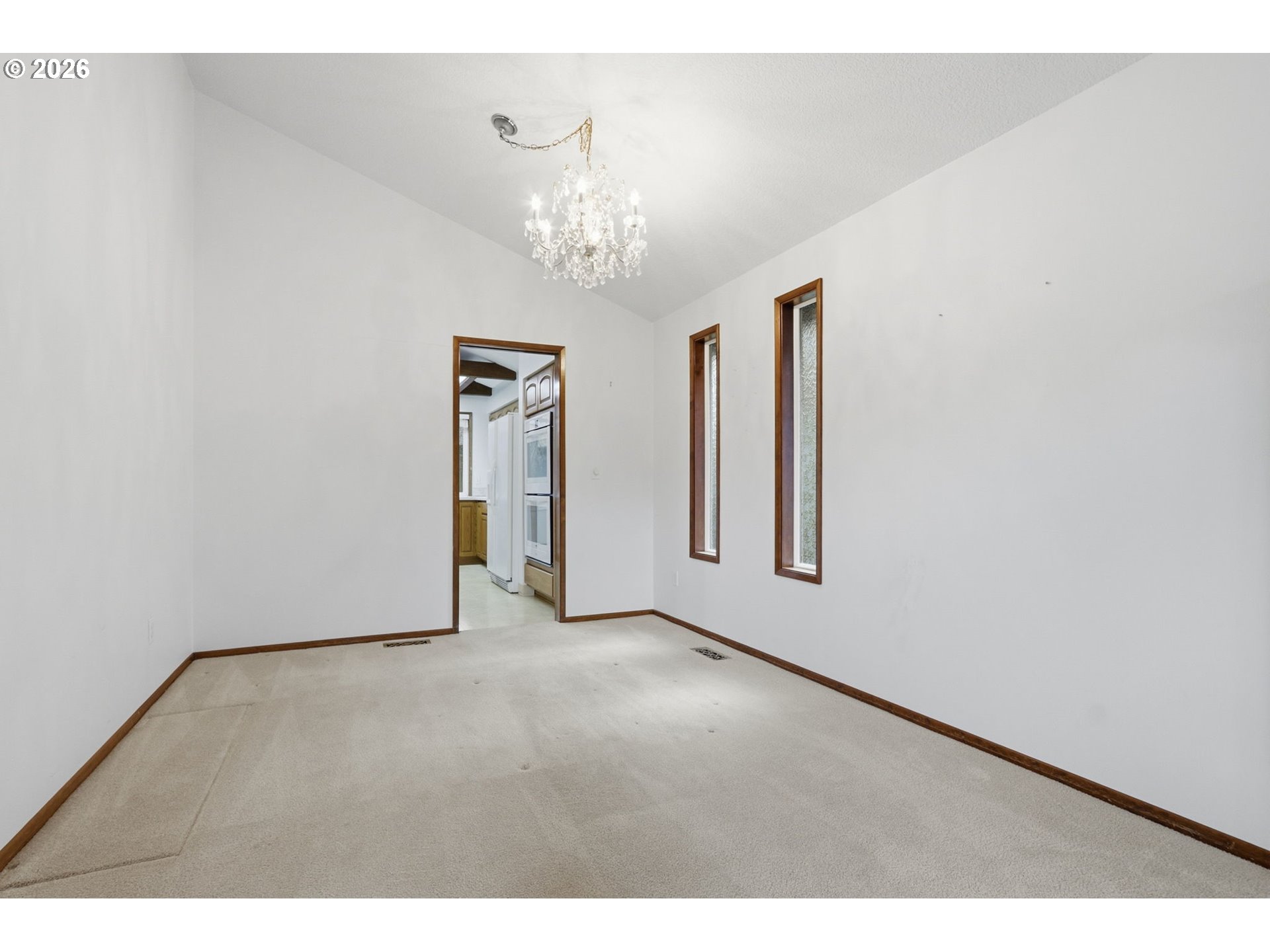 7250 Southwest 28th Court Beaverton, OR 97008 - Photo 11 of 45 a view of an empty room and chandelier