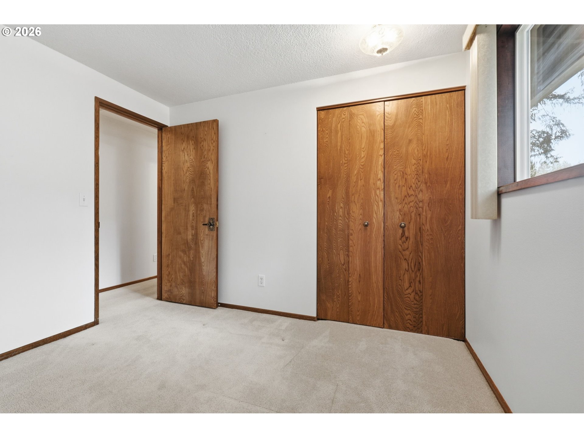 7250 Southwest 28th Court Beaverton, OR 97008 - Photo 26 of 45 a view of an empty room with window and stairs