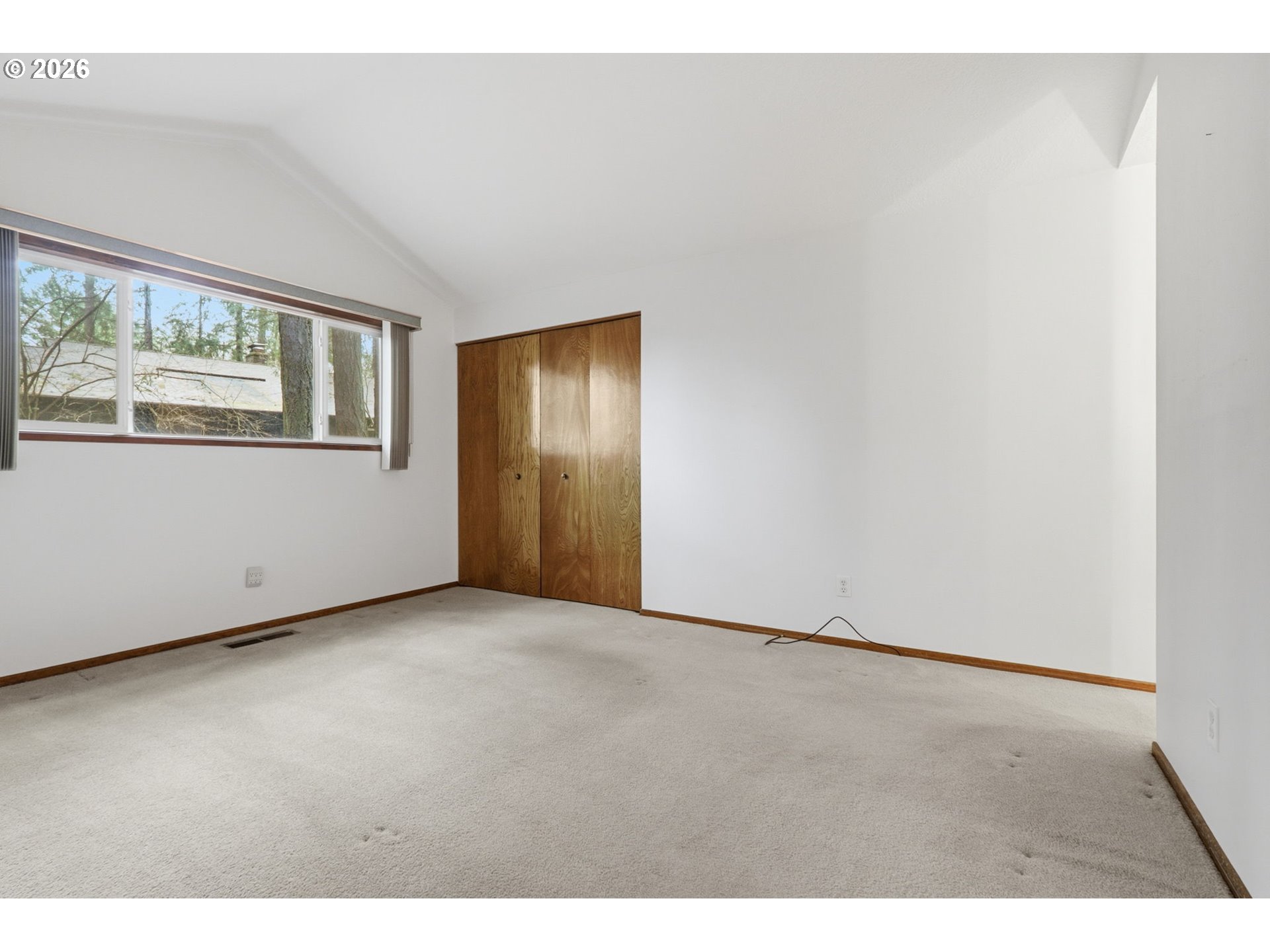 7250 Southwest 28th Court Beaverton, OR 97008 - Photo 27 of 45 a view of an empty room with a window