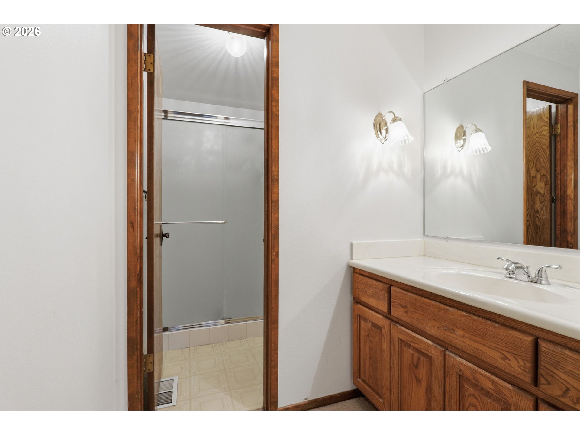 7250 Southwest 28th Court Beaverton, OR 97008 - Photo 32 of 45 a bathroom with a sink and a mirror