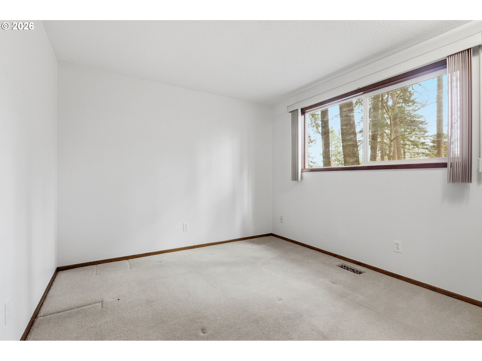 7250 Southwest 28th Court Beaverton, OR 97008 - Photo 34 of 45 a view of an empty room with a window