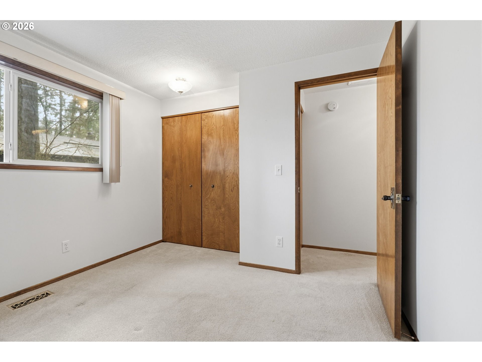 7250 Southwest 28th Court Beaverton, OR 97008 - Photo 35 of 45 a view of an empty room with a window