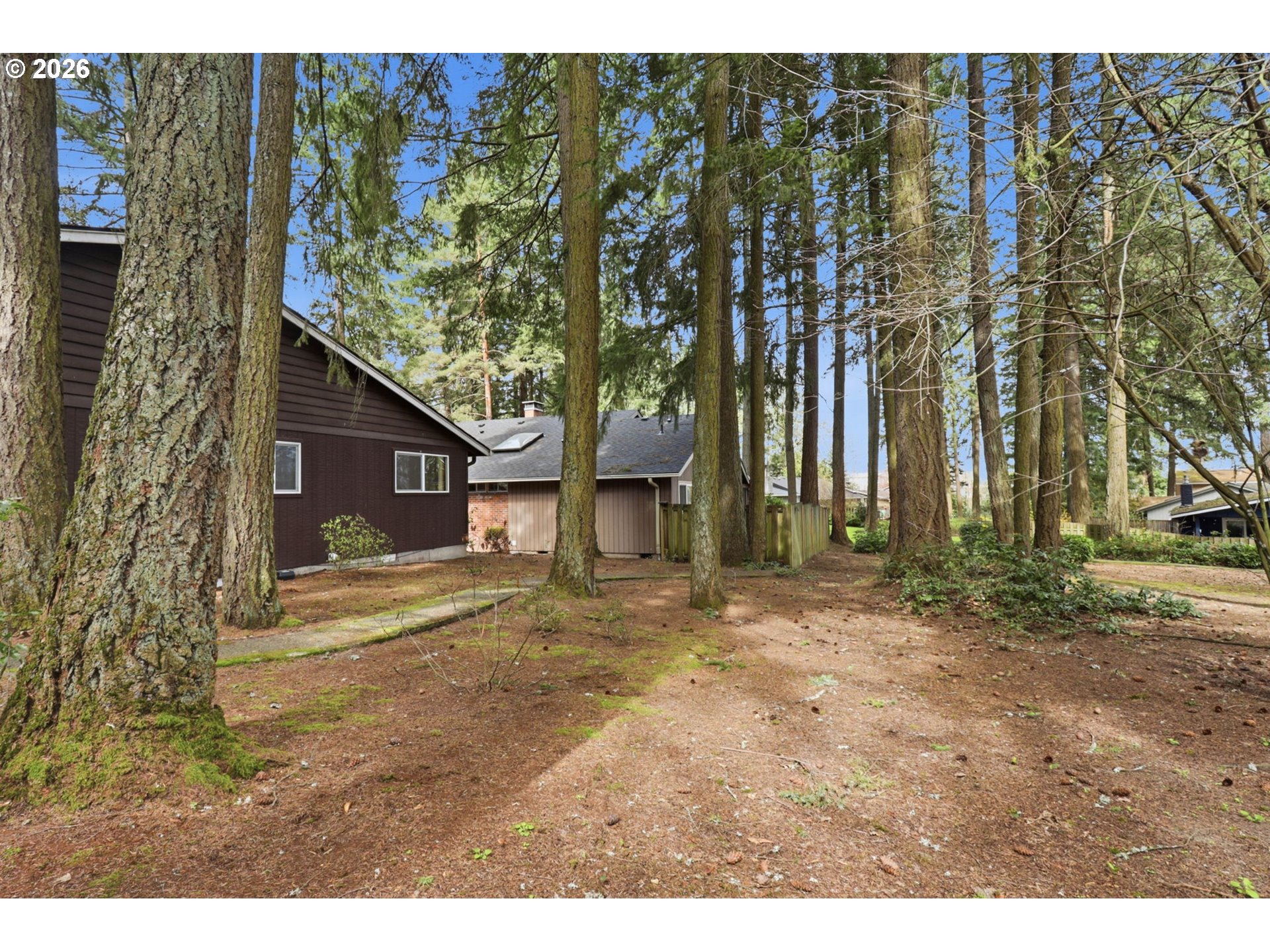 7250 Southwest 28th Court Beaverton, OR 97008 - Photo 38 of 45 a big house with trees in front of it