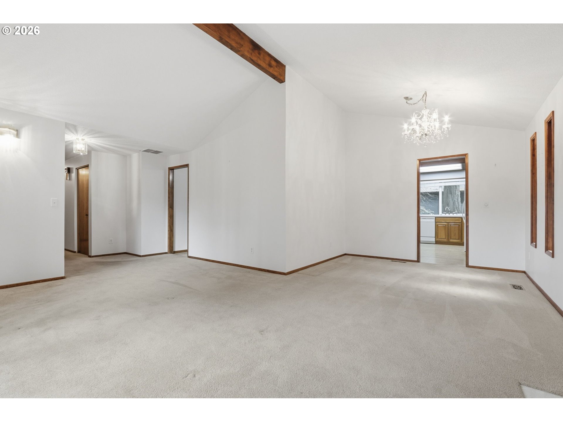 7250 Southwest 28th Court Beaverton, OR 97008 - Photo 9 of 45 a view of a big room with windows and chandelier fan