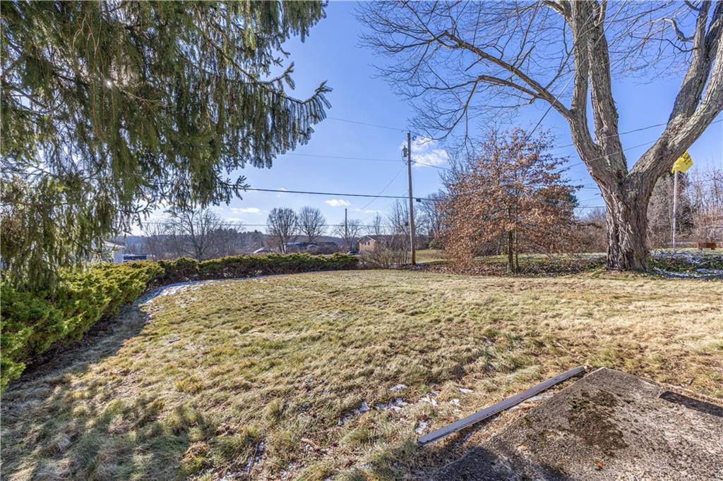 422 New Castle Road Butler, PA 16001 - Photo 27 of 27 a backyard of a house with lots of green space