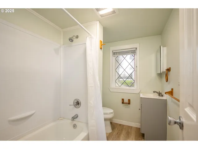 a bathroom with a bathtub and shower